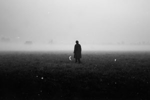 man standing on grass